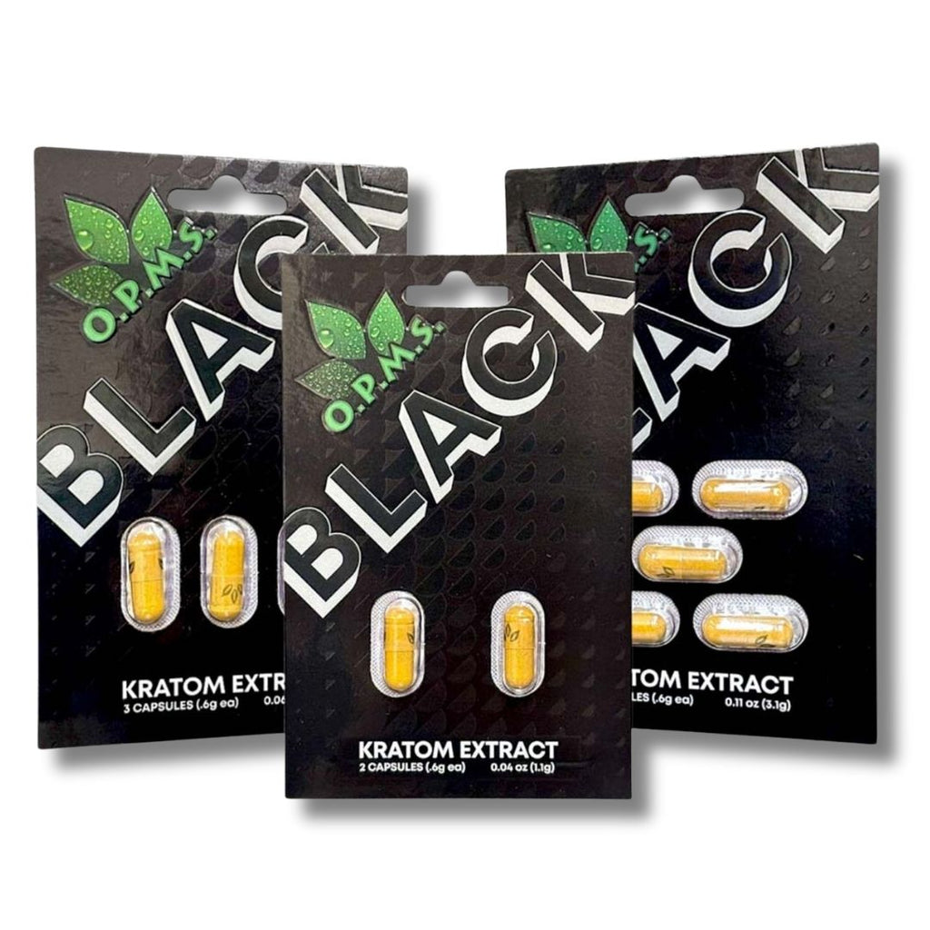 Three packages of O.P.M. Black Kratom Extract on a white background